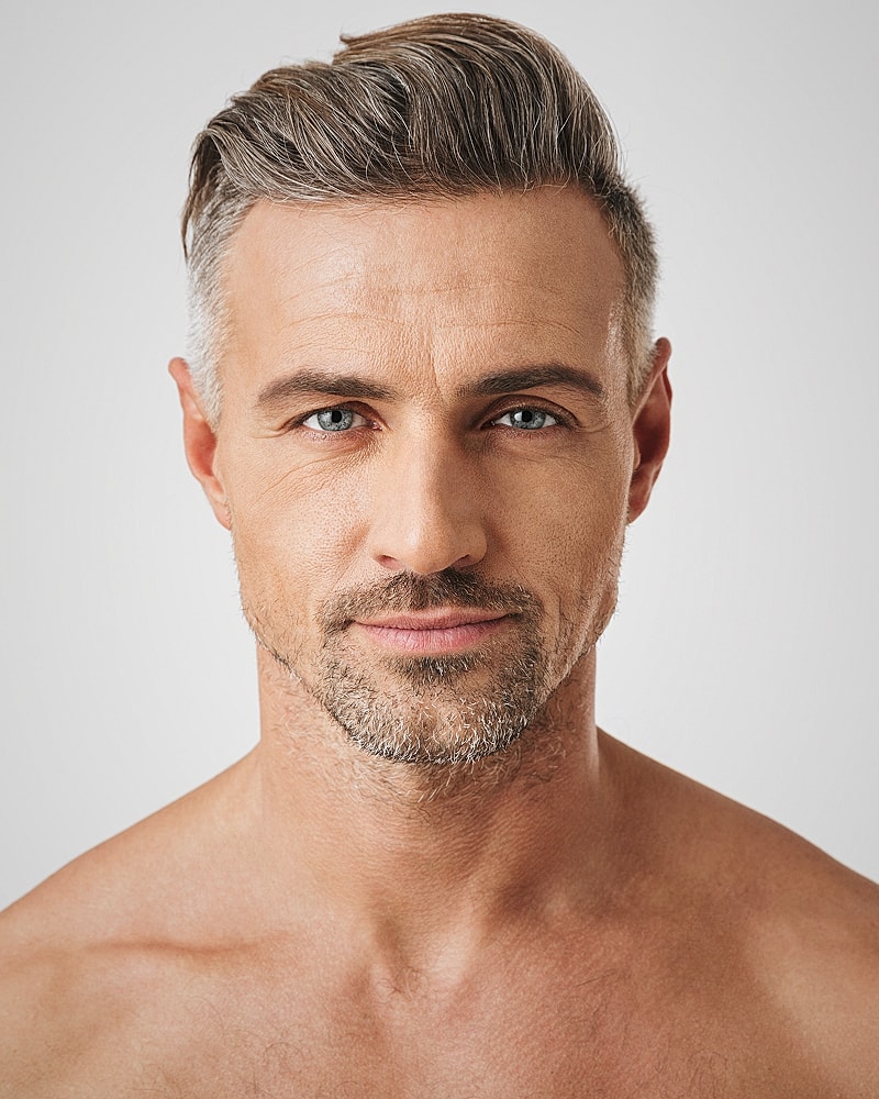 Portrait of a handsome, mature man with stubble.